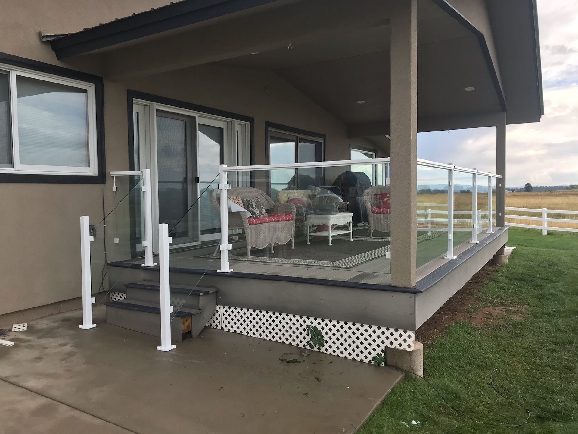 A house with a porch and a glass railing