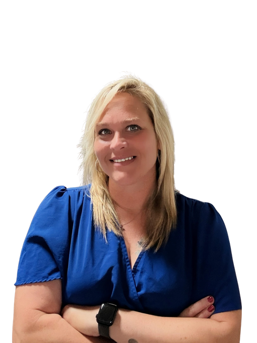 Woman in a blue blouse smiling with arms crossed against a white background