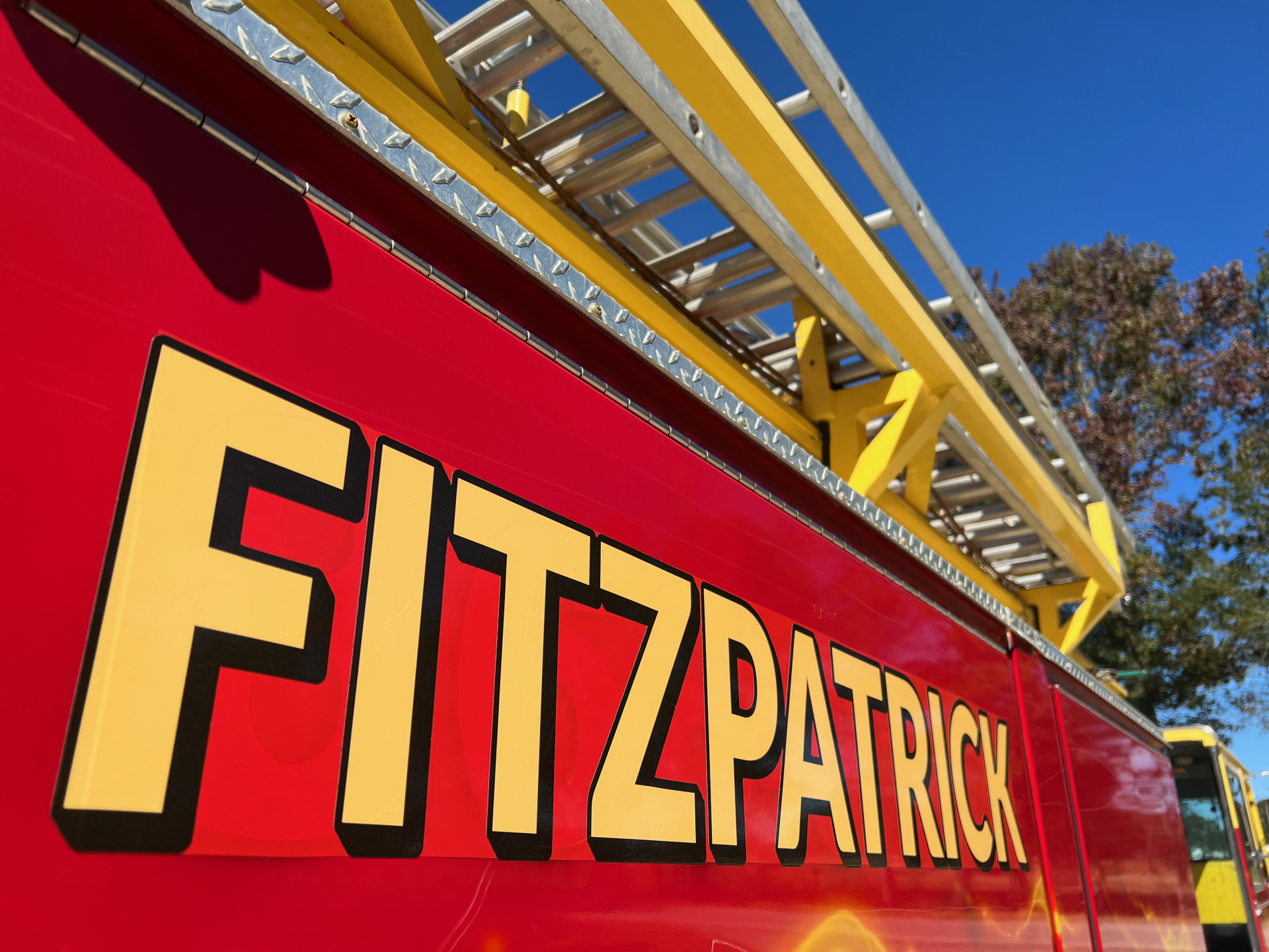 A red fire truck with the name fitzpatrick on it