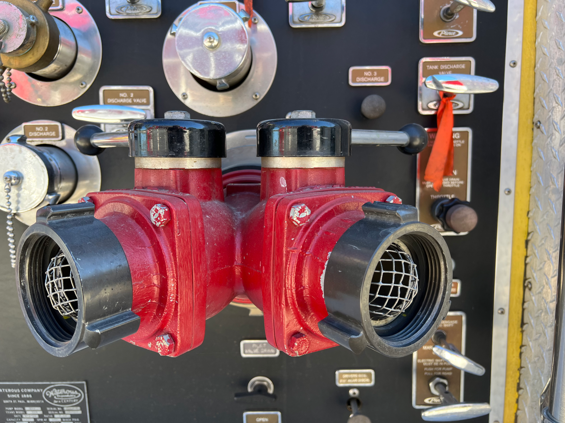 A close up of a fire hydrant on a wall