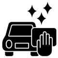 Black car with a hand wiping it, with sparkles indicating cleaning or polishing