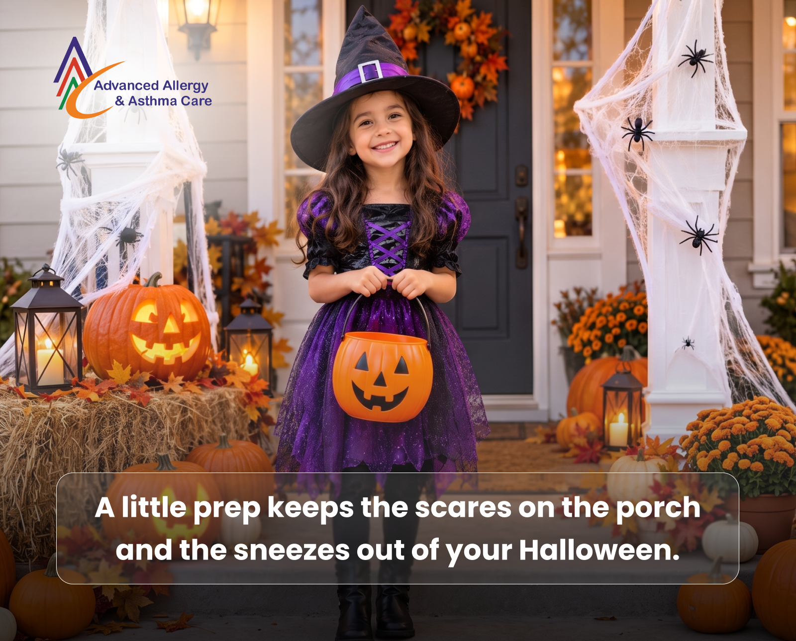 Child in a Halloween costume holding a pumpkin bucket on a decorated porch with jack-o’-lanterns and