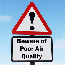 A sign that says beware of poor air quality