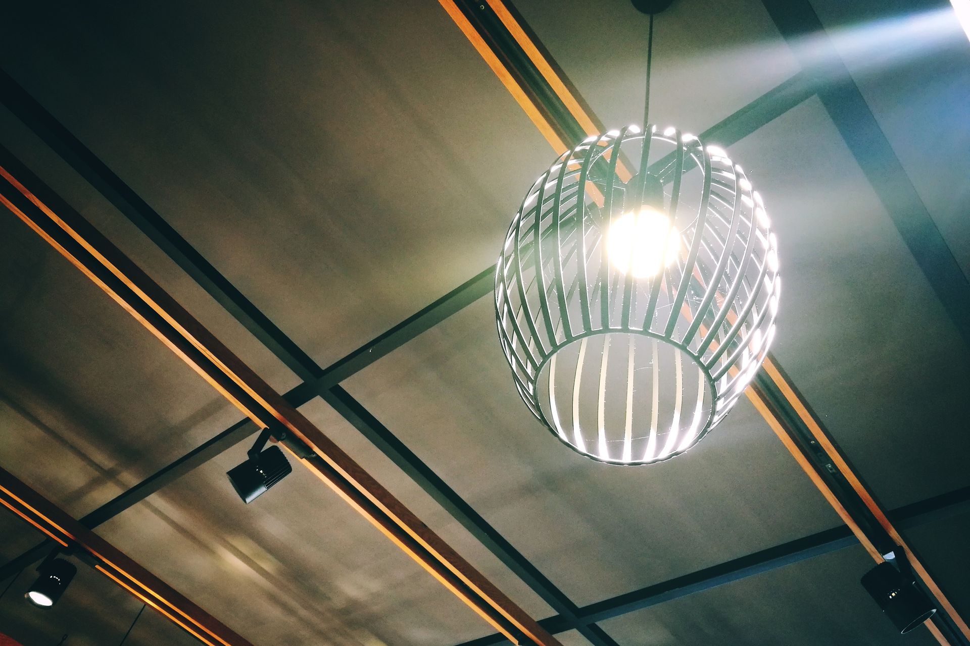 A light hanging from the ceiling in a dark room