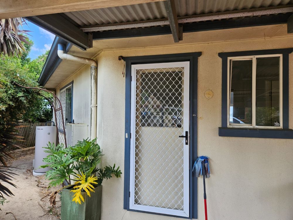 A house with a fenced in door and a window — O & D House Wash & Cleaning Services in Glenvale, QLD
