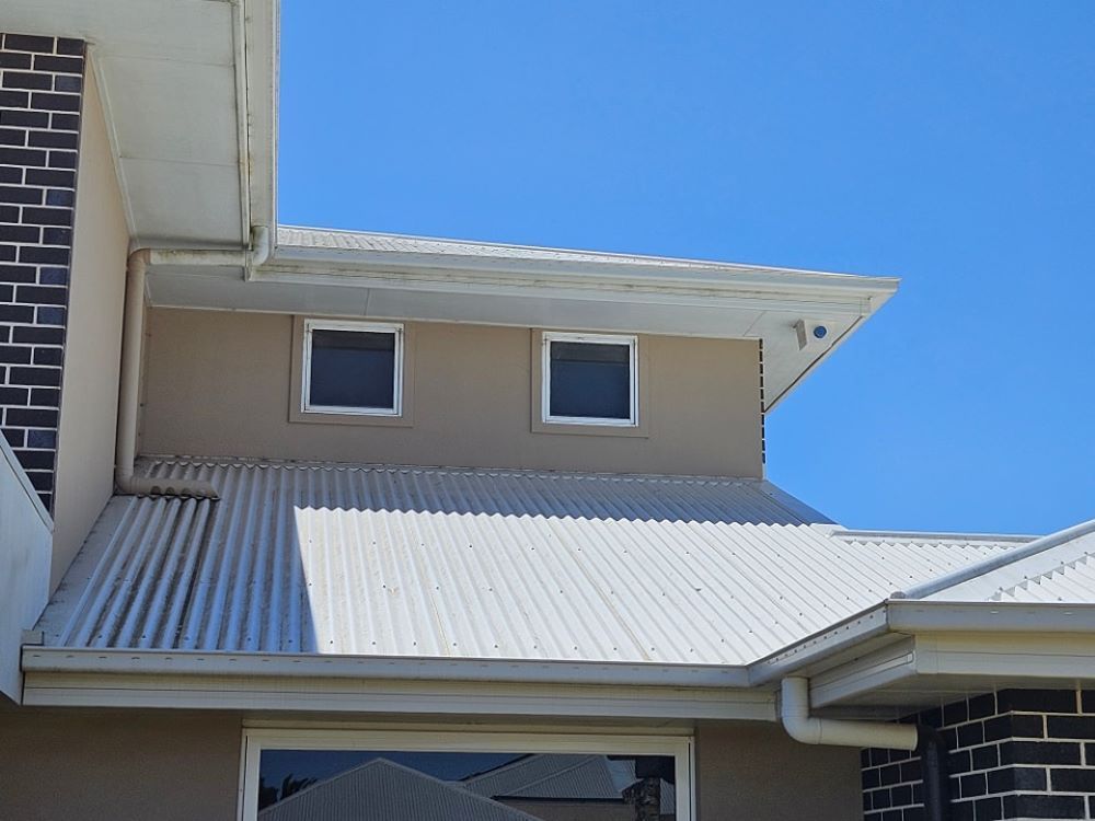 A House With a White Roof and Two Windows — O & D House Wash & Cleaning Services in Oakey, QLD