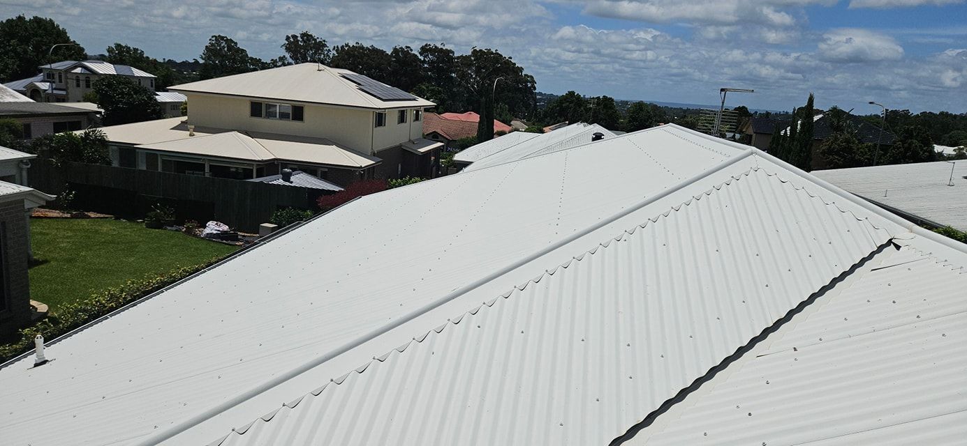 A White Roof With a Lot of Houses in the Background — O & D House Wash & Cleaning Services in Highfields, QLD