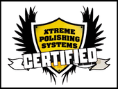 Xtreme Polishing Systems certified logo on yellow shield with black wings and white banner