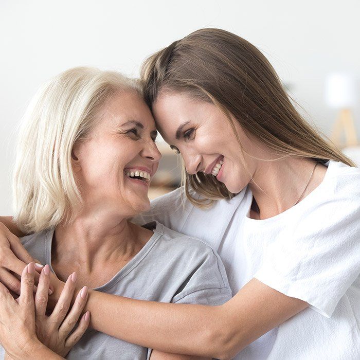 Mother and Daughter Hugging Each Other