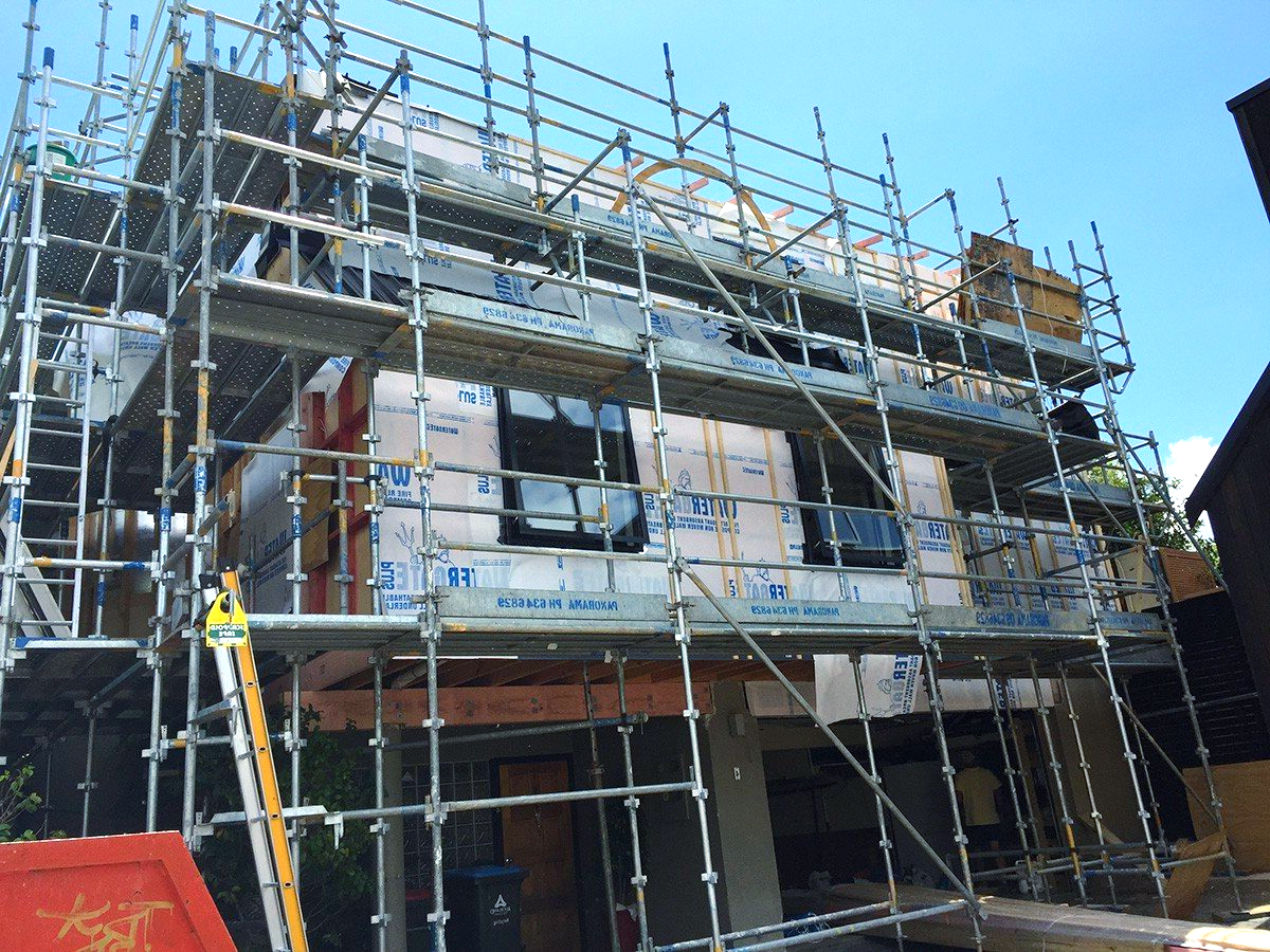 House under construction with scaffolding.