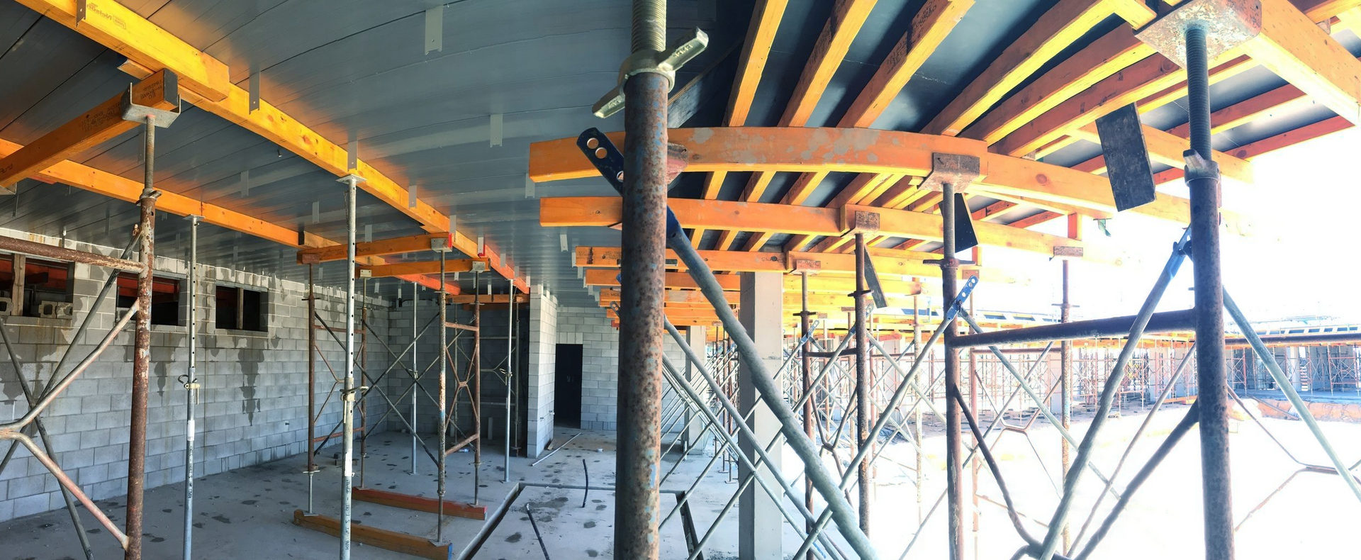A building under construction with a lot of scaffolding under it.