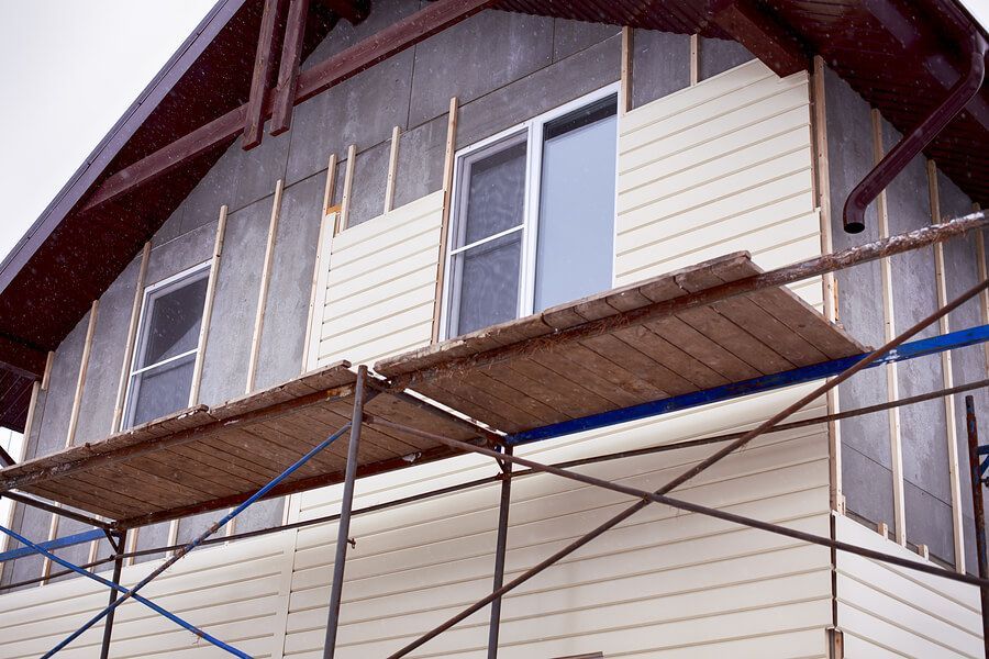 a house under construction with scaffolding around it