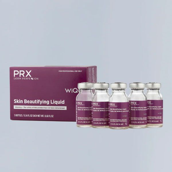PRX Skin Beautifying Liquid boxes and vials in purple packaging on a light gray background