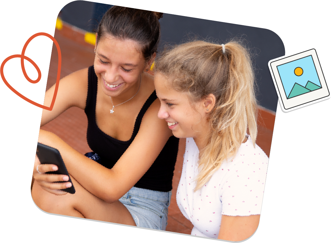 Two teen girls are sitting next to each other looking at a cell phone.