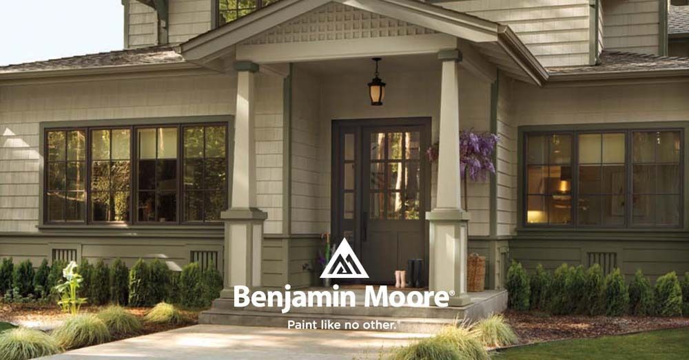 Benjamin Moore paint ad on a craftsman-style house exterior with front porch and garden