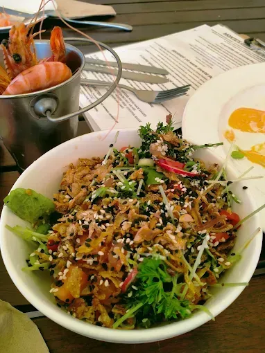 Bowl of food with sesame seeds and shrimp in a bucket — The Beach Bar and Restaurant at Montes in Cape Gloucester, QLD