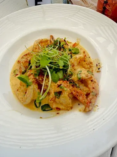 Shrimp in creamy sauce with sprouts and green onions — The Beach Bar and Restaurant at Montes in Cape Gloucester, QLD