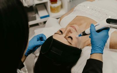A woman is getting a facial treatment at a beauty salon.