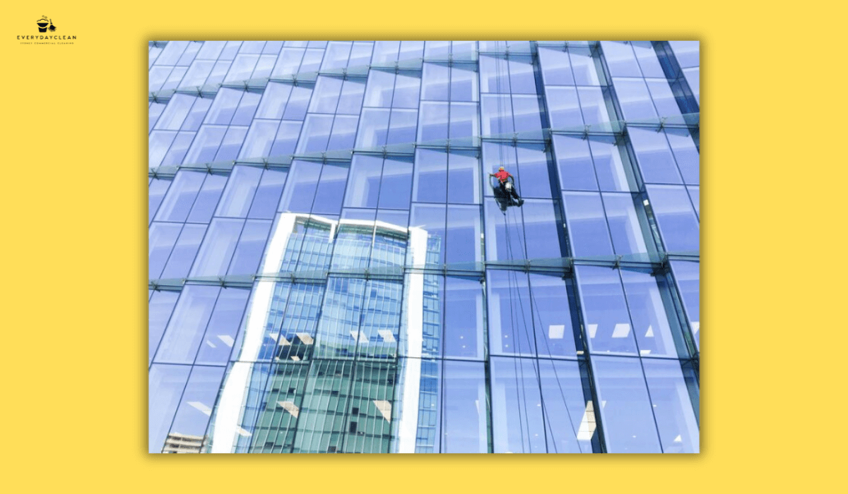 cleaner maintaining office building windows