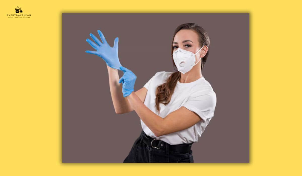 cleaner wearing PPE gloves mask