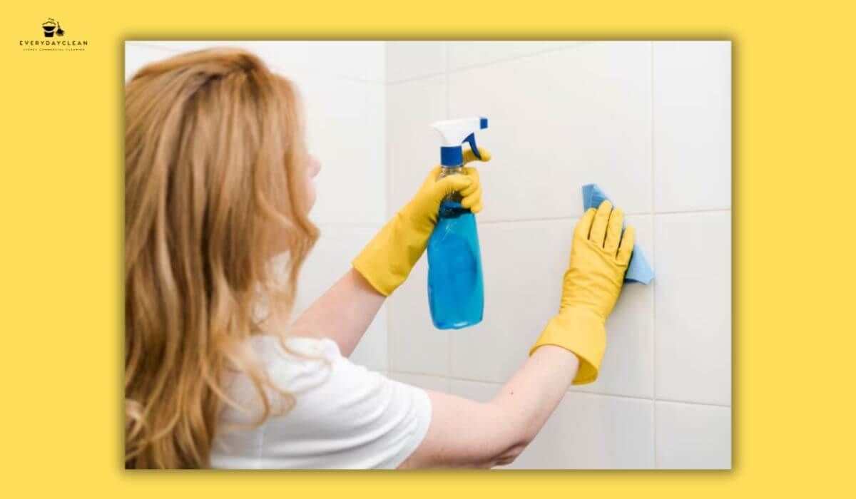 homeowner cleaning wall mould