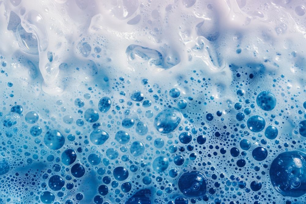 Bubbles in shades of blue and white forming a foamy texture, representing office cleaning industry standards in Sydney.