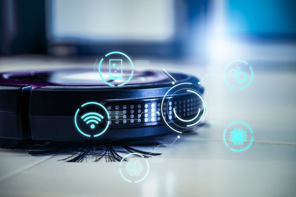 Robot vacuum cleaner with digital icons, cleaning a tile floor.