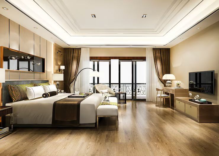 Luxurious bedroom with king bed, balcony, wooden floors, and modern furnishings.