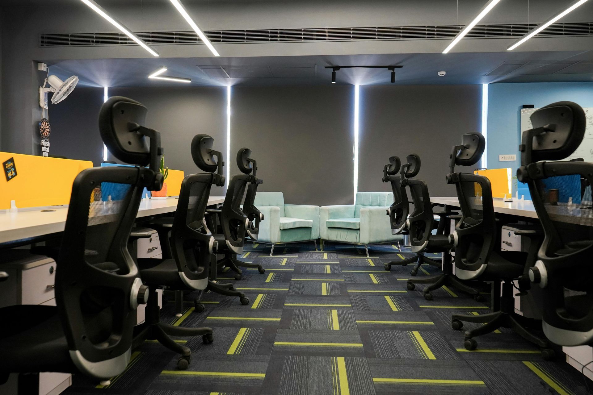Modern Sydney office cleaning with ergonomic workstations and lounge seating