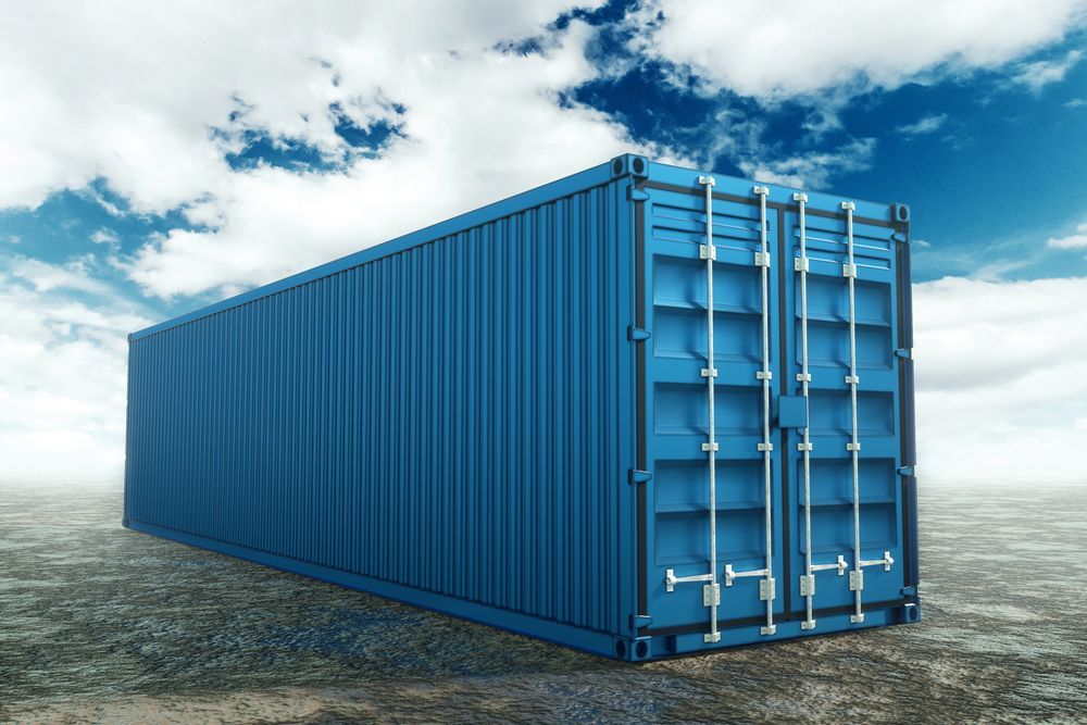 A Blue Shipping Container is Sitting in the Middle of a Desert — Buck Removals & Storage in Wagga Wagga, NSW