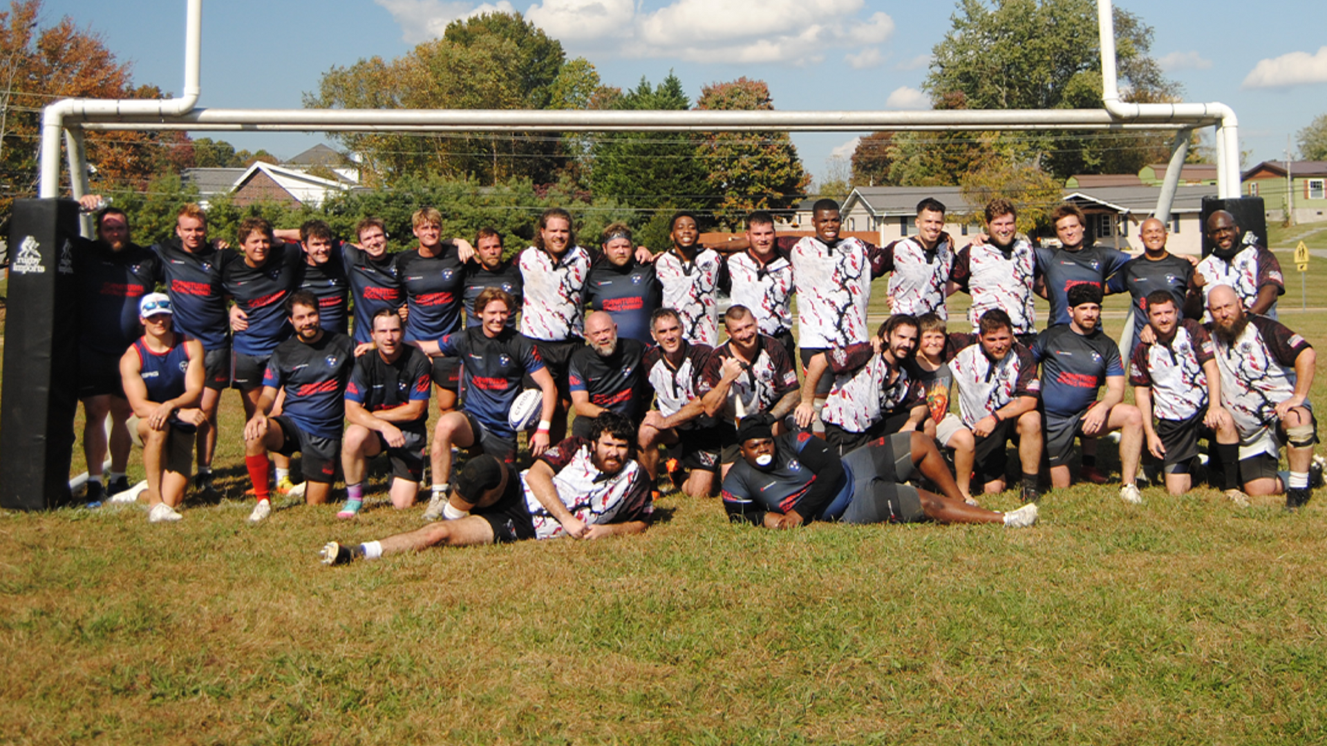 Menβs rugby team group photo on the field in Johnson City, Tennessee after a match