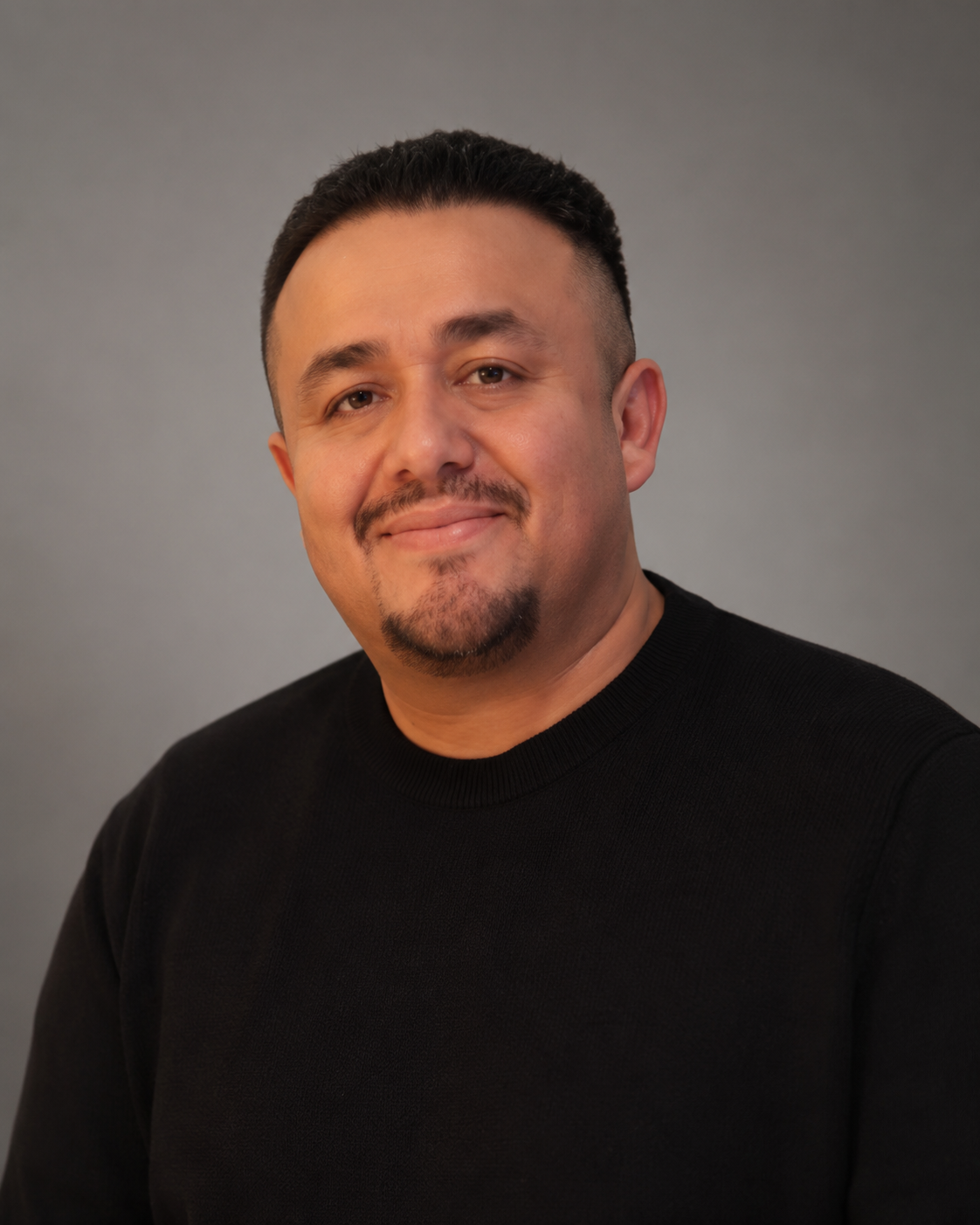 Larry Zelaya at a professional DJ event setup with crowd and lighting