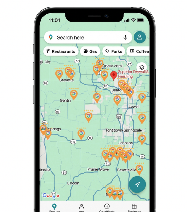 Mobile phone displaying a map with location pins, searching for restaurants, in a town.