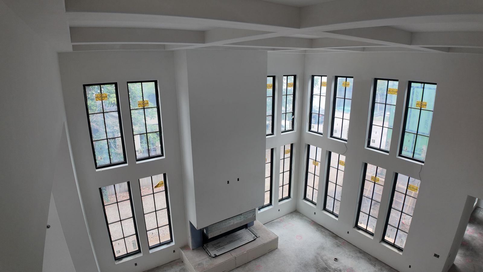 Two-story great room viewed from above, Bentonville custom home drywall