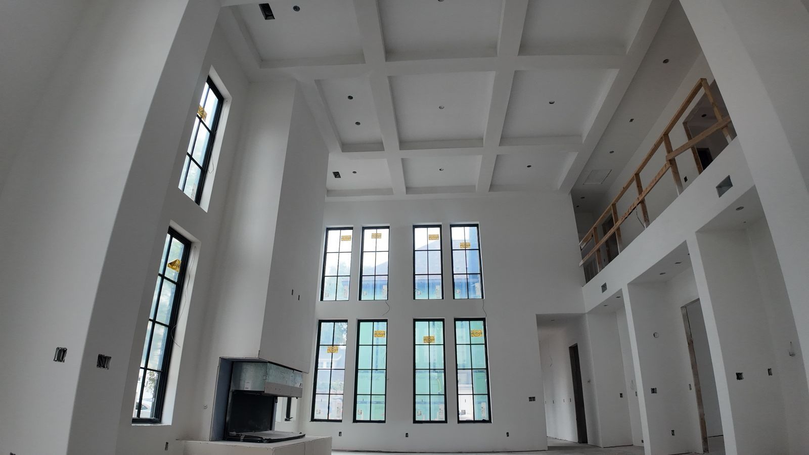 Two-story great room with Level 5 smooth drywall finish, Project Odell custom home in Bentonville, Arkansas