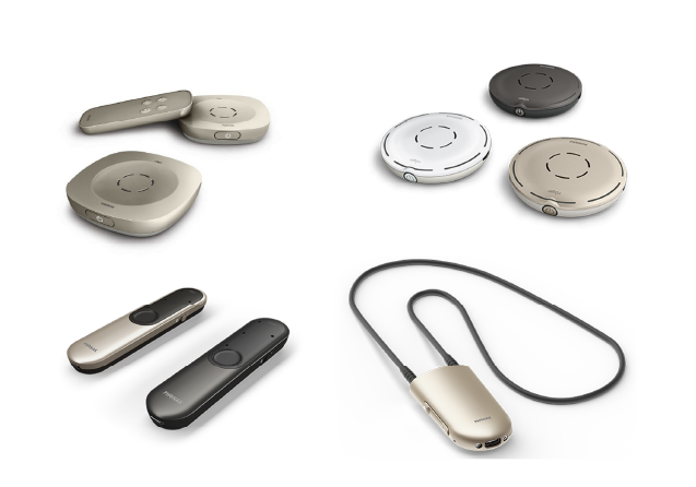 A bunch of different types of hearing aids on a white background
