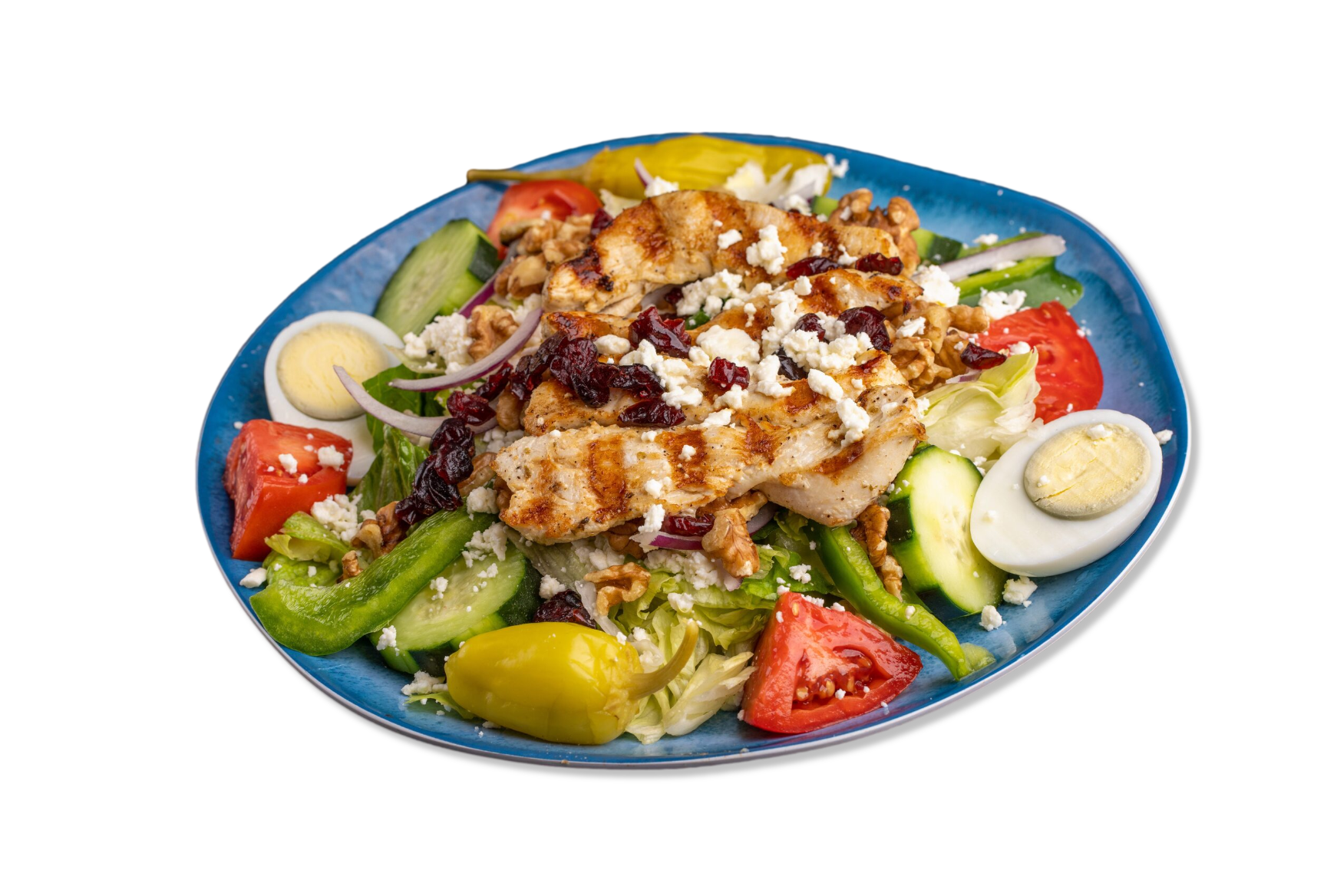 A blue plate topped with a salad with chicken , eggs , and vegetables.