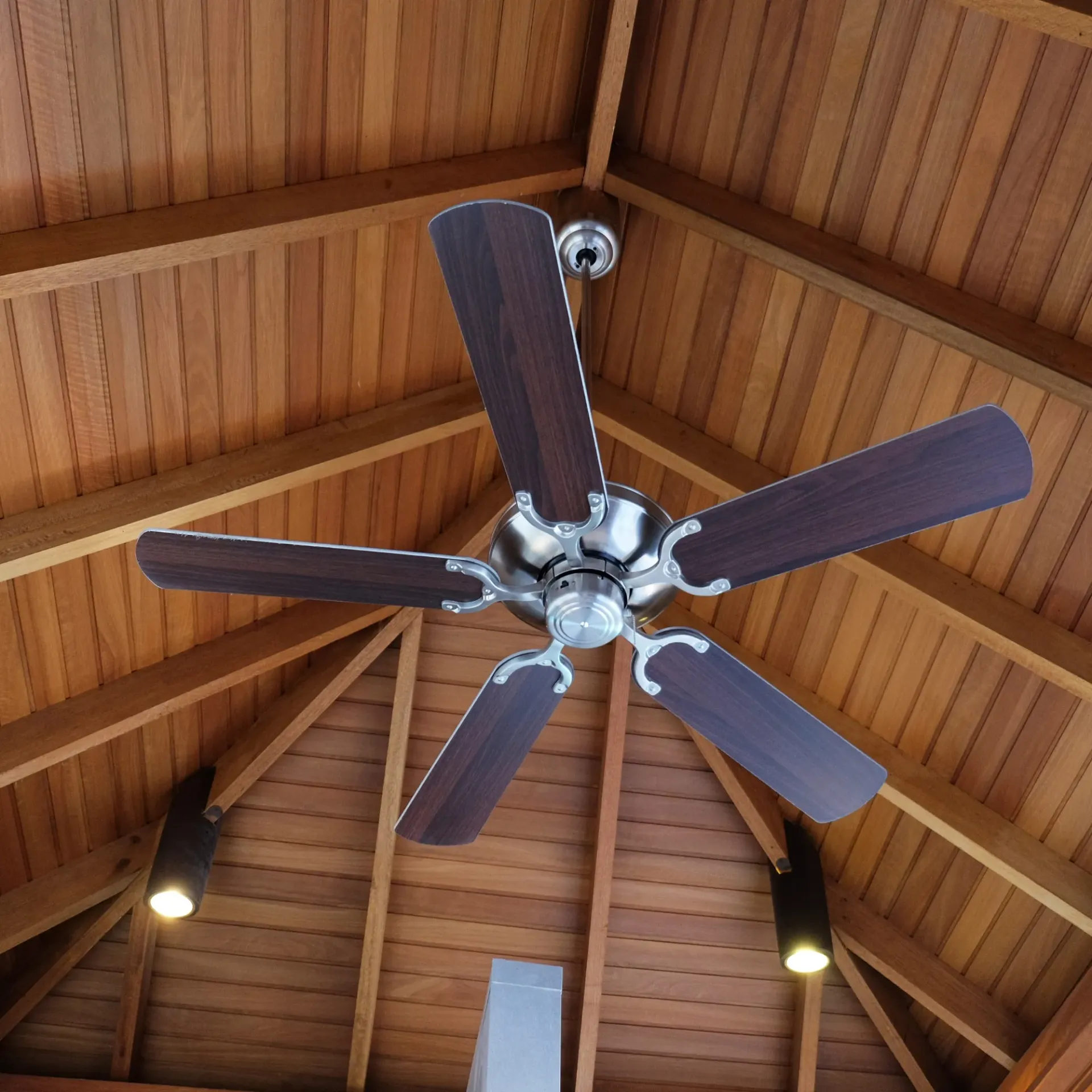 Sanchez Electric and Remodeling - A ceiling fan is hanging from a wooden ceiling