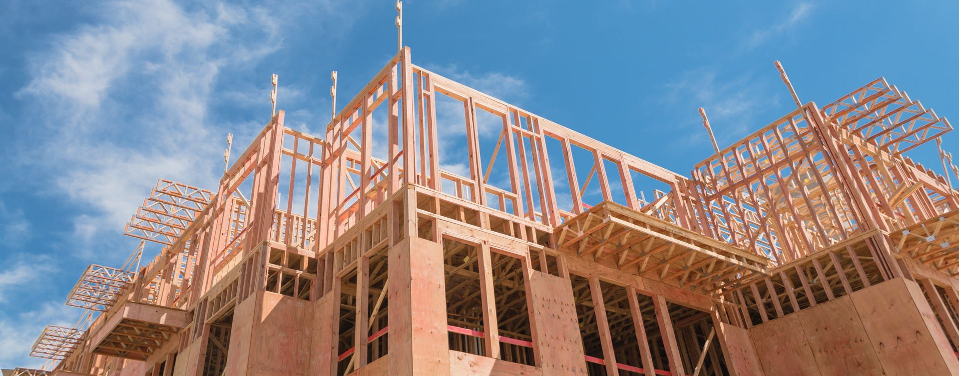 A building under construction with wooden framing