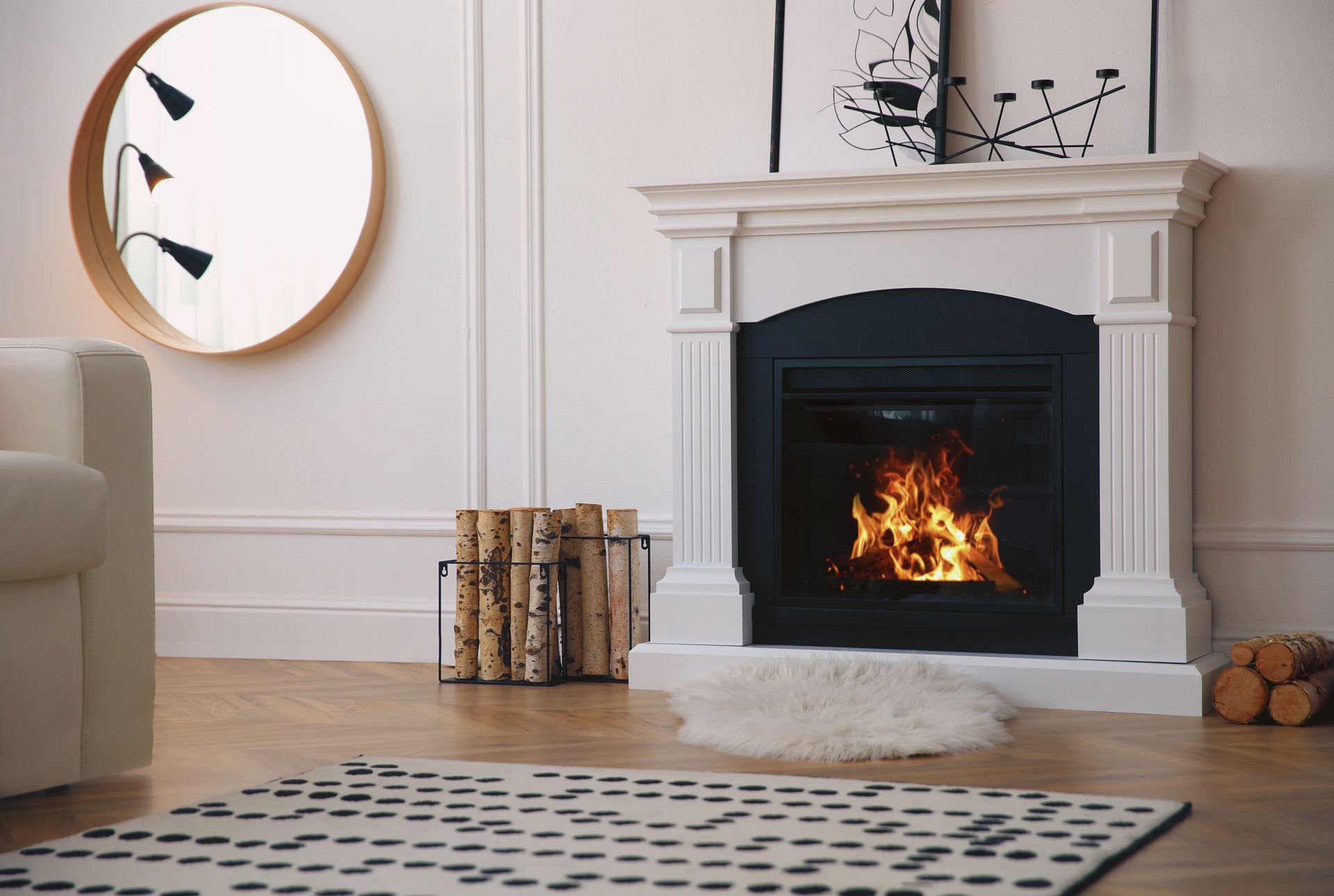 A cozy living room with a lit fireplace