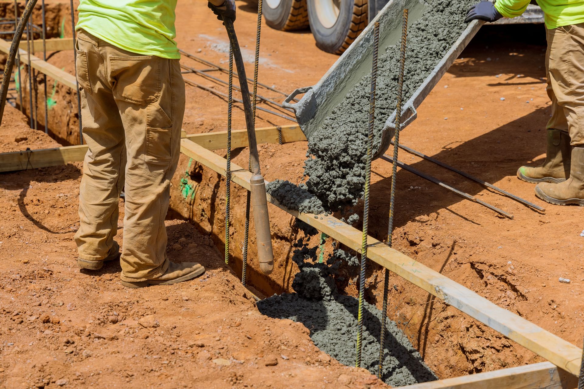 Construction workers pouring concrete