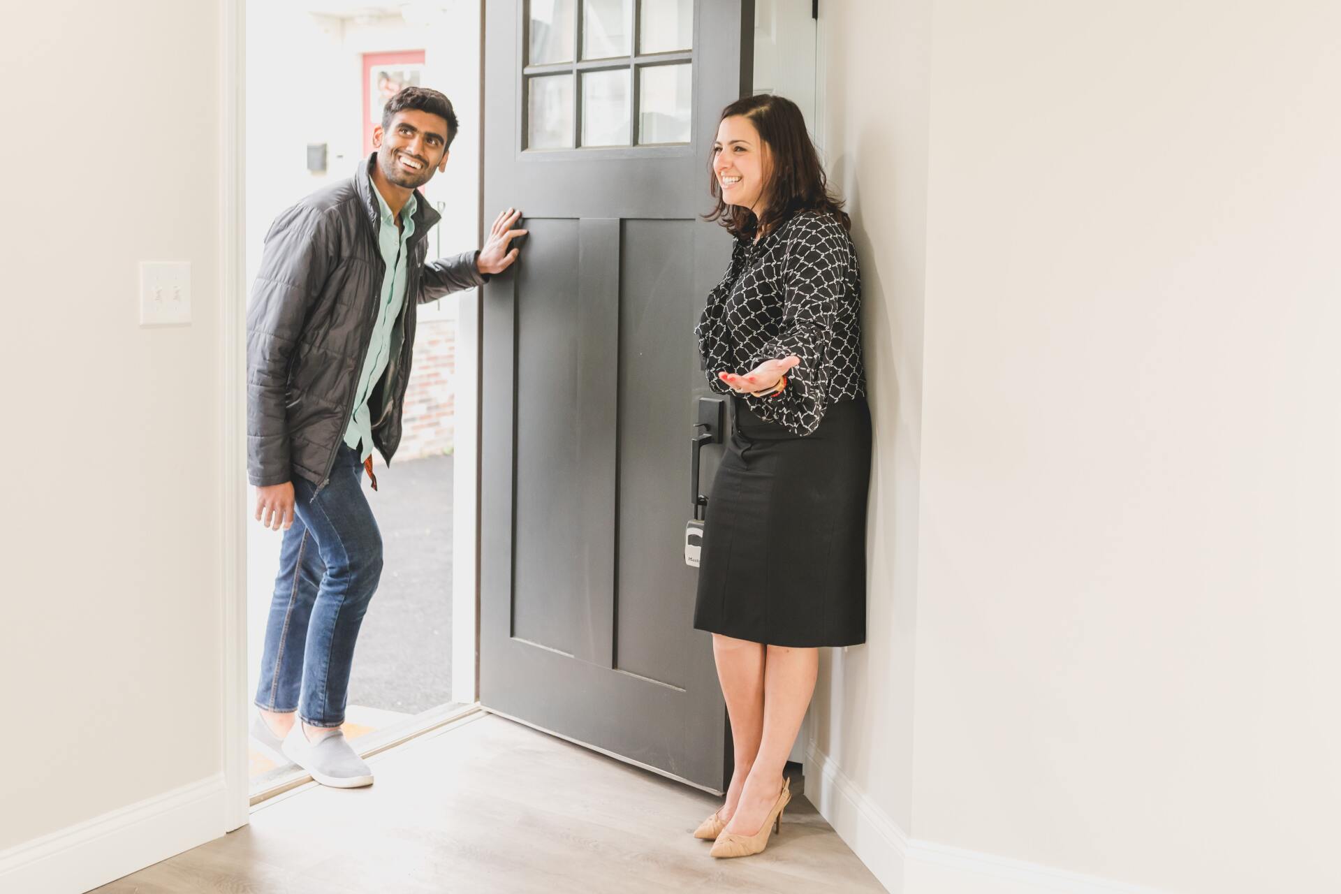 Real estate agent with client in apartment - Residential Real Estate Sales