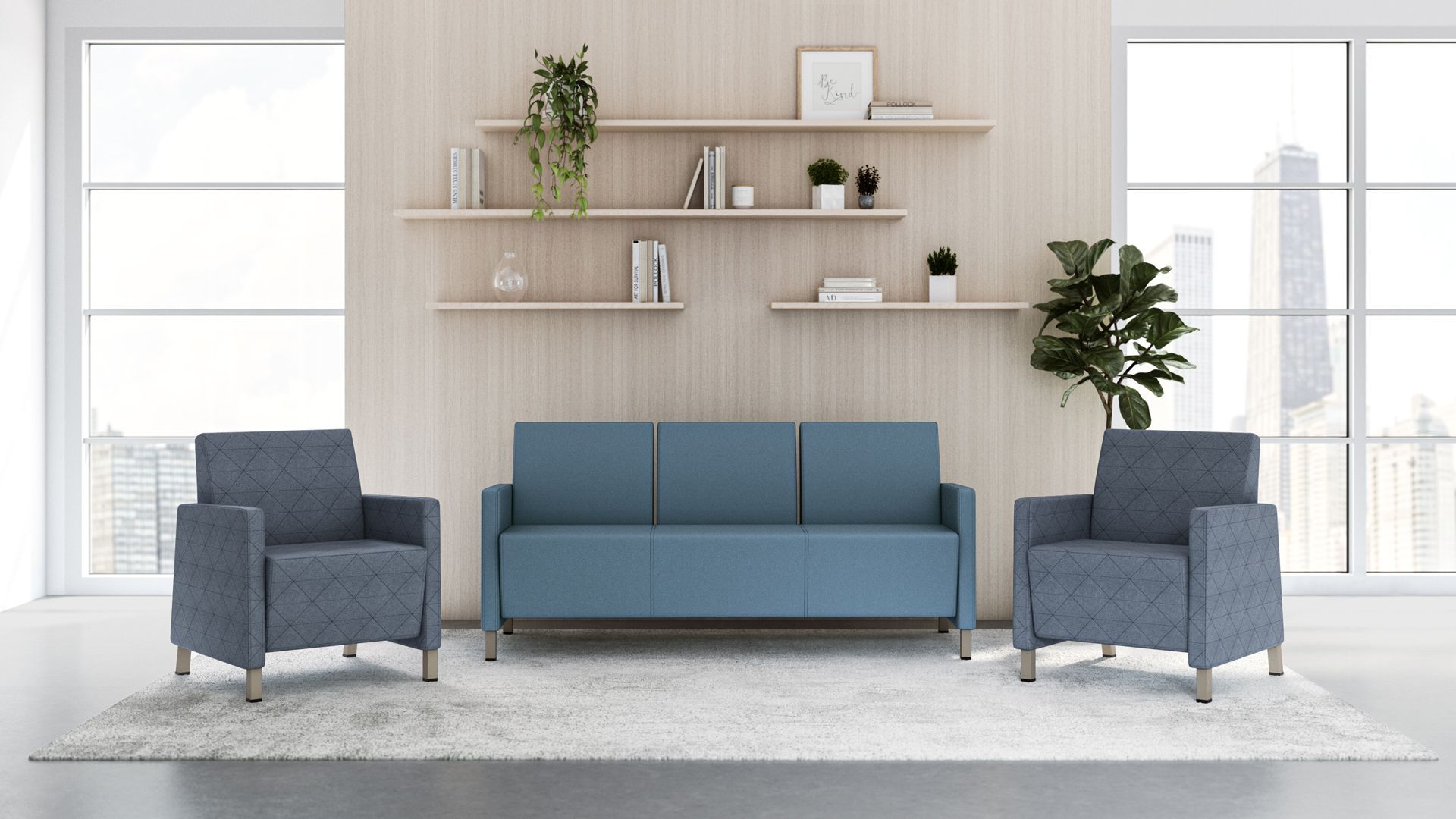 A living room with a blue couch and two grey chairs