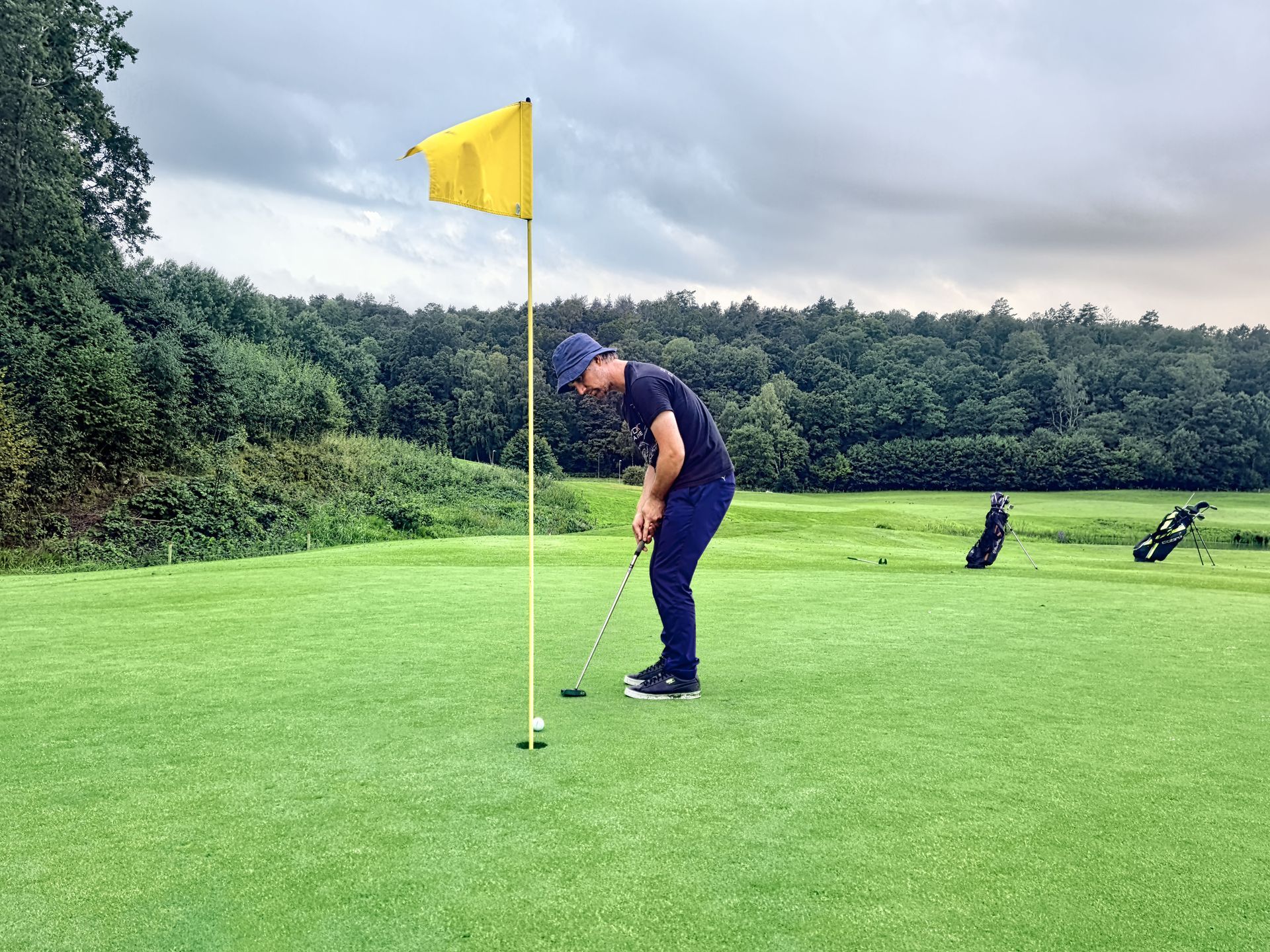 Golfer at a private club course in early morning mist