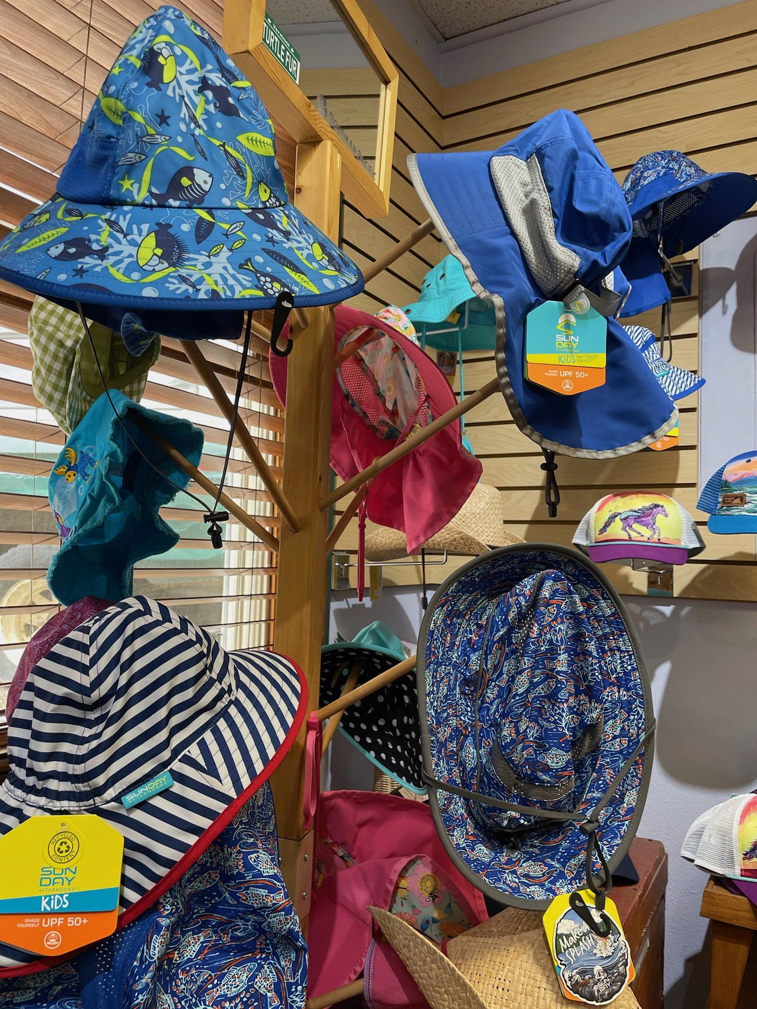 kids hats on display rack