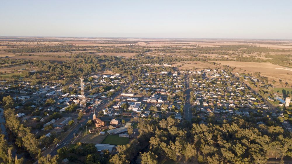 Aerial View of a Small Town With Tree-lined Streets and Scattered Homes — Robert Seeliger Painter & Decorator in Warren, NSW