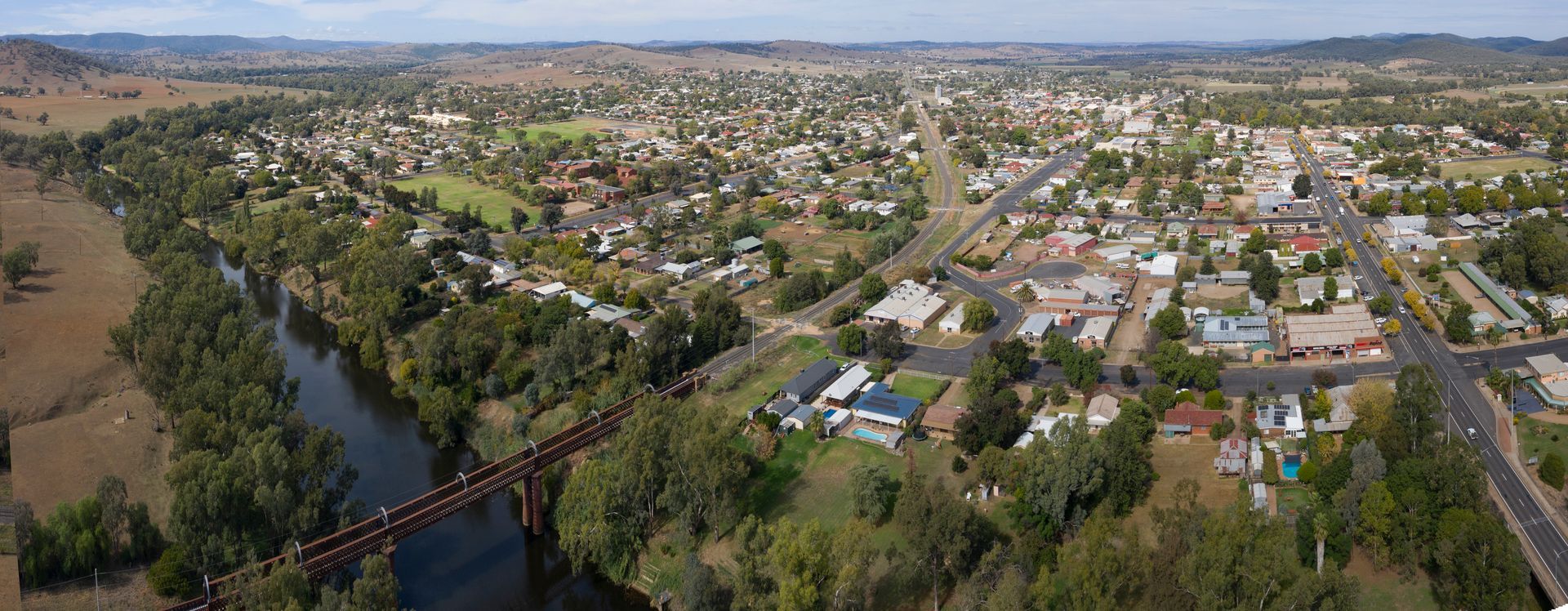Aerial View of a Town Beside a River, With a Bridge and Hills — Robert Seeliger Painter & Decorator in Wellington, NSW