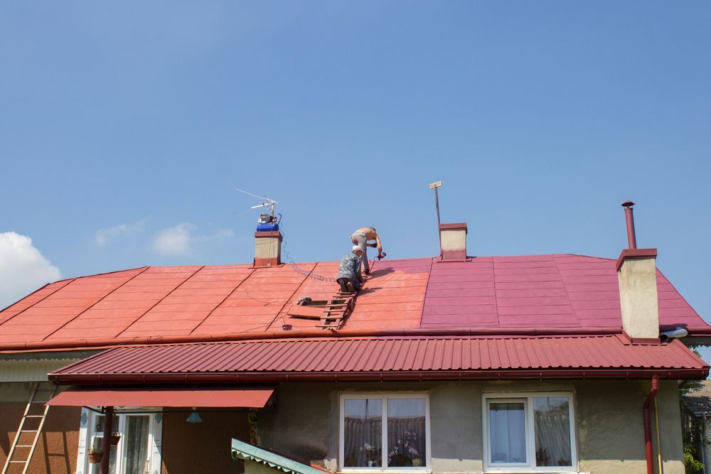 Workers Painting A Red Roof — Robert Seeliger Painter And Decorator in Dubbo, NSW