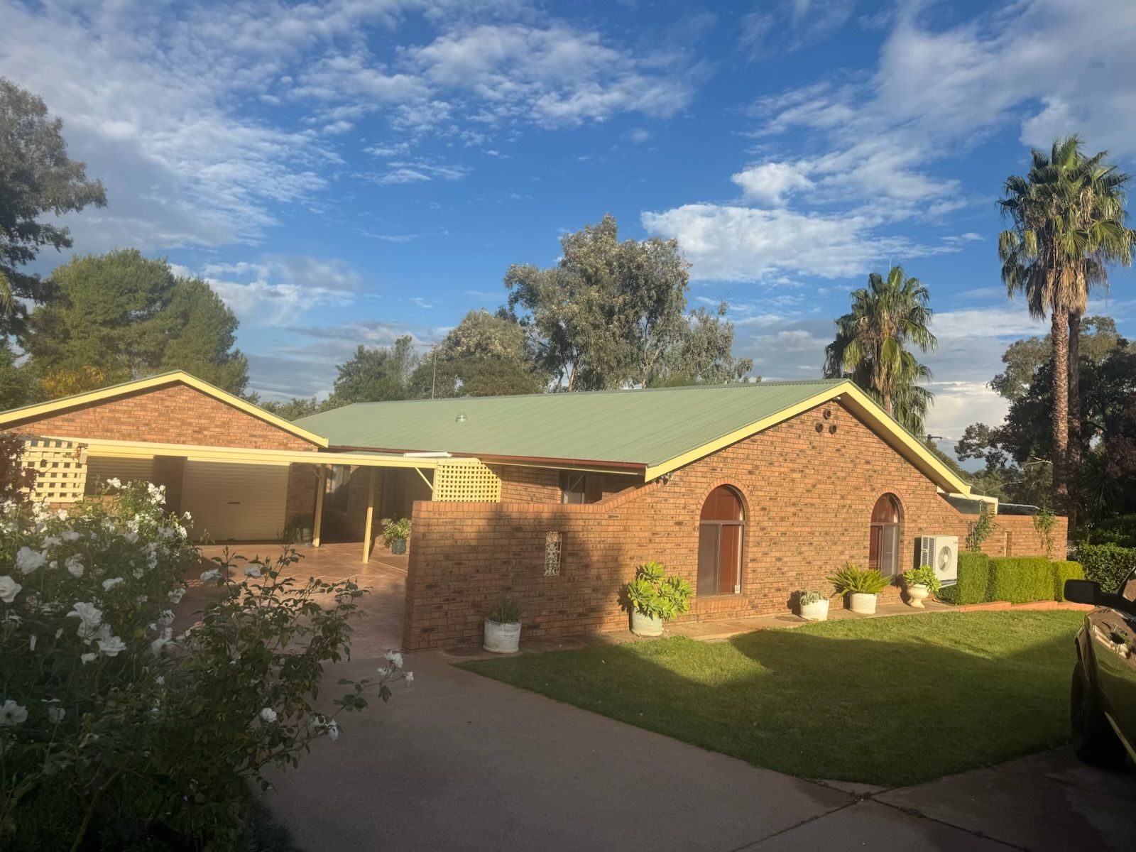 A Single-Story Brick House With a Light Green Roof — Robert Seeliger Painter & Decorator in Dubbo, NSW