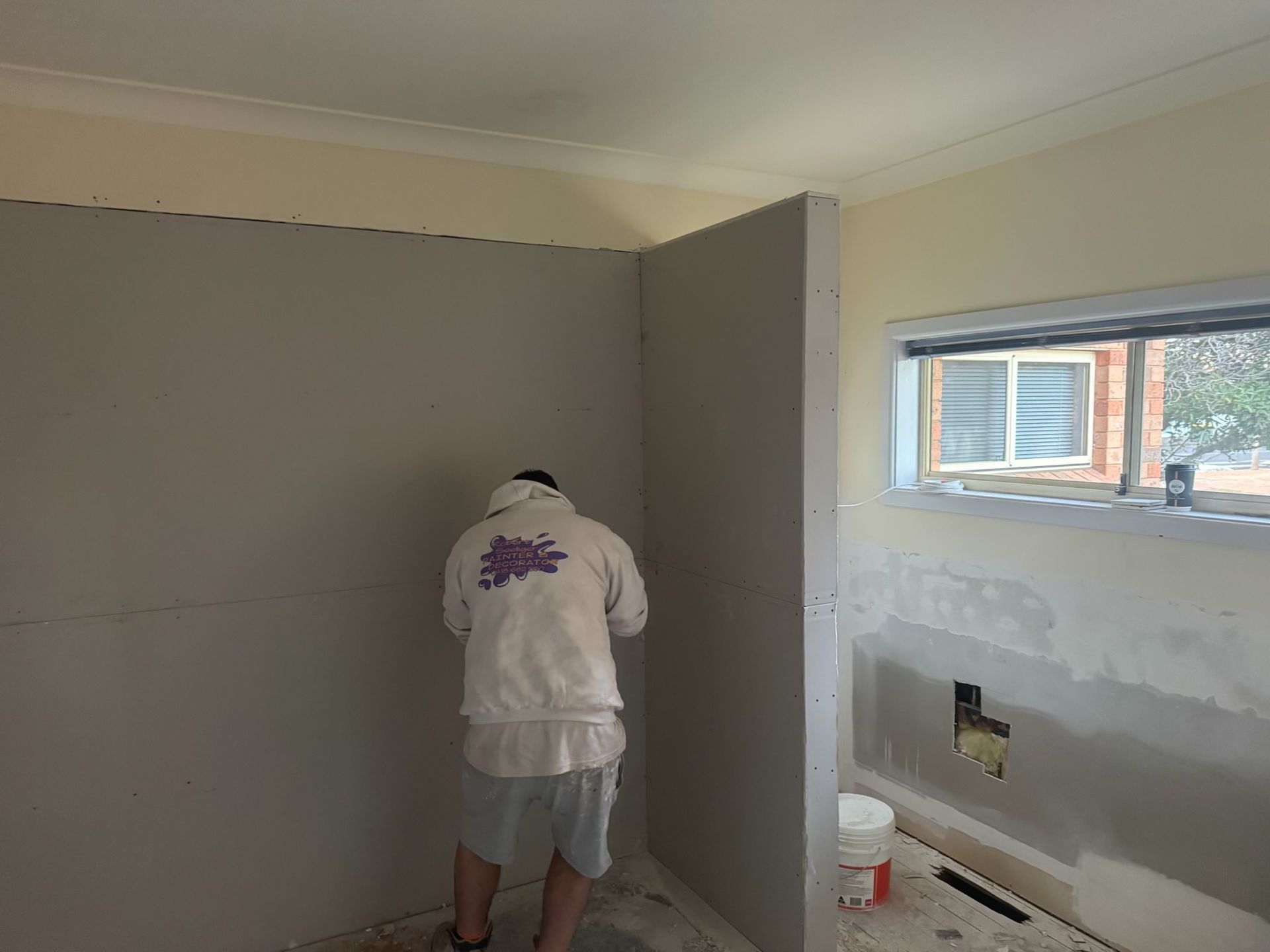 A Person Wearing a White Hoodie — Robert Seeliger Painter & Decorator in Dubbo, NSW